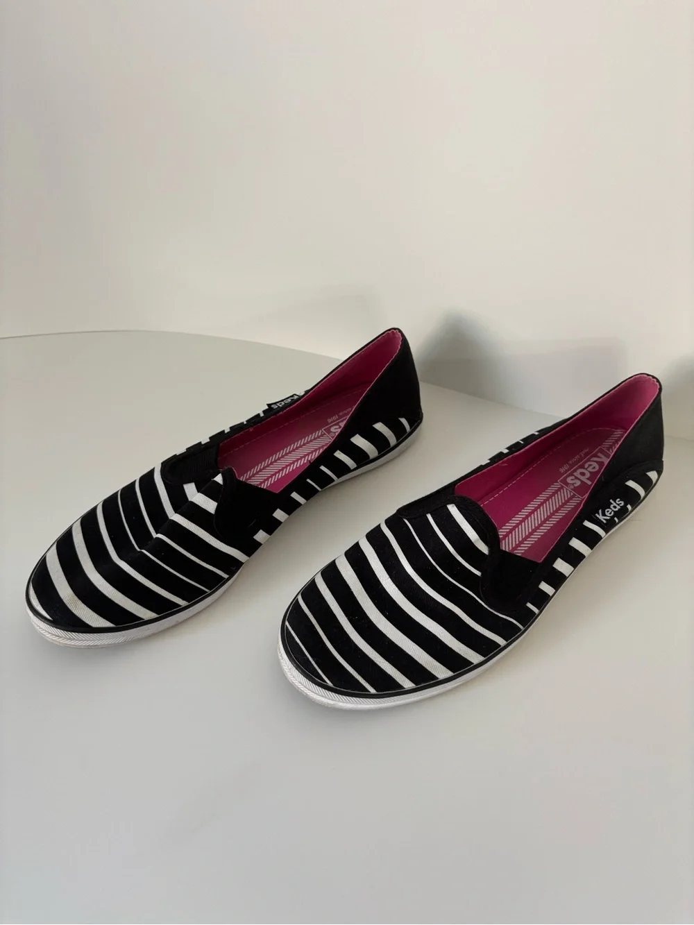 Keds Women’s Black & White Striped Slip-On Sneakers with Pink Insole